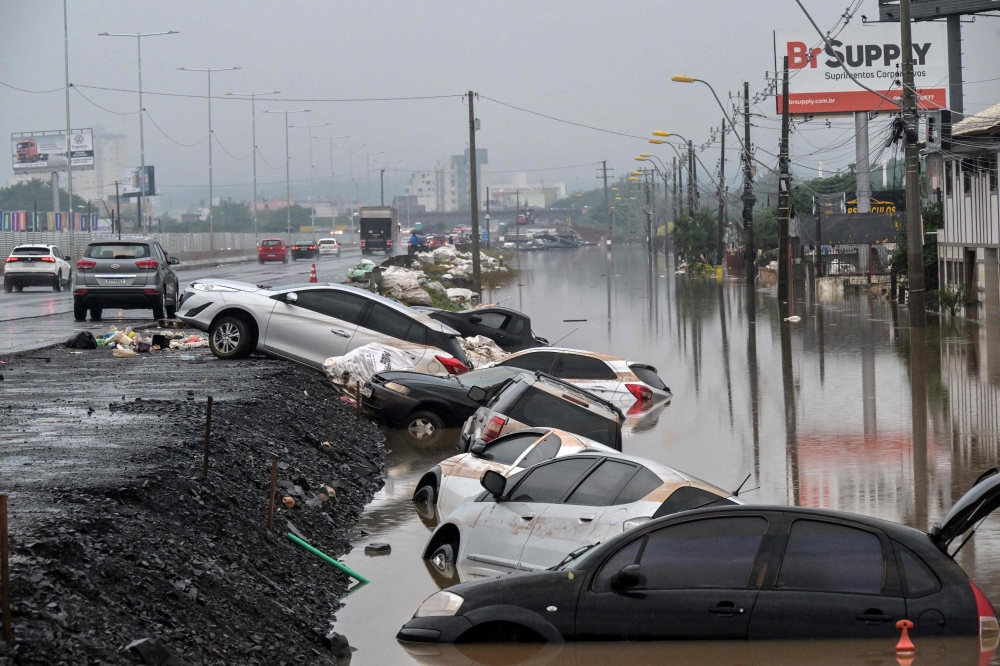 View of stranded cars along the BR-116 road in Sao Leopoldo, Rio Grande do Sul, Brazil, on May 12, 2024. (Photo by Nelson ALMEIDA / AFP)
