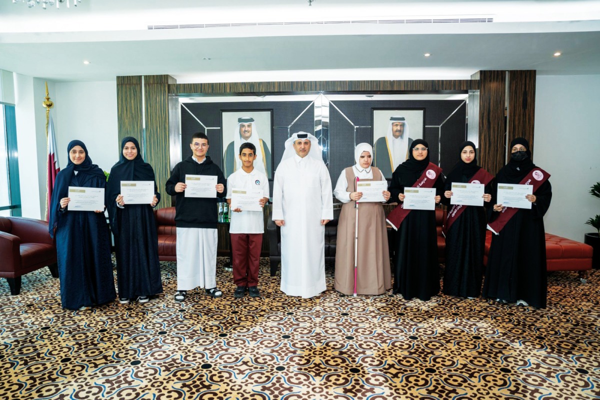 Minister of Environment and Climate Change H E Dr. Abdullah bin Abdulaziz bin Turki Al Subaie with winners of 2024 environmental drawing and essay competition.