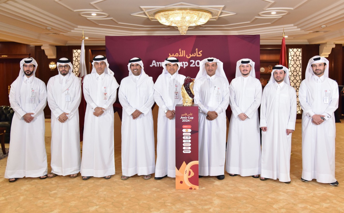 Dr. Abdulbasit Ahmed Al Shaibei, the CEO of QIIB along with other officials pose for a group photo.