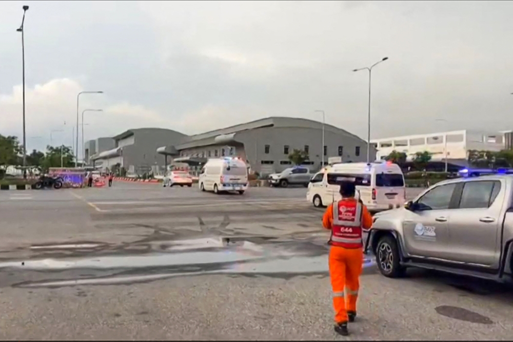 This frame grab from a video by Phongsak Suksi taken and released on May 21, 2024 and made available via AFPTV shows ambulances leaving the fire station at Suvarnabhumi Airport in Bangkok, after a Singapore Airlines London-Singapore flight hit severe turbulence and was forced to make an emergency landing. Photo by various sources / AFP