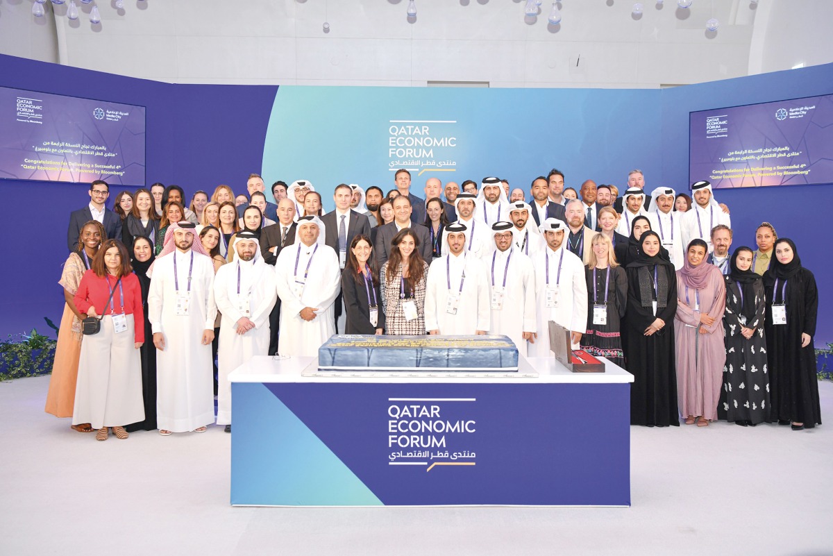 Officials posing for a group picture during the fourth edition of Qatar Economic Forum.