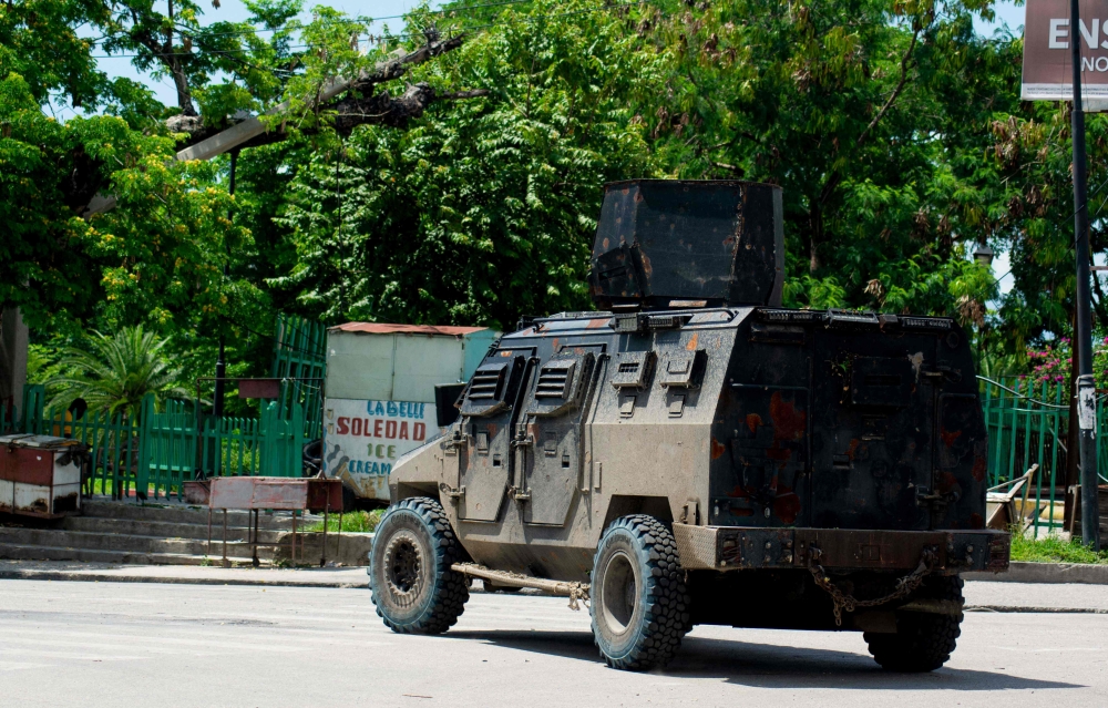 A police tank patrols the area where armed gangs have spread terror, in Port-au-Prince, Haiti, on May 24, 2024. Photo by Clarens SIFFROY / AFP.