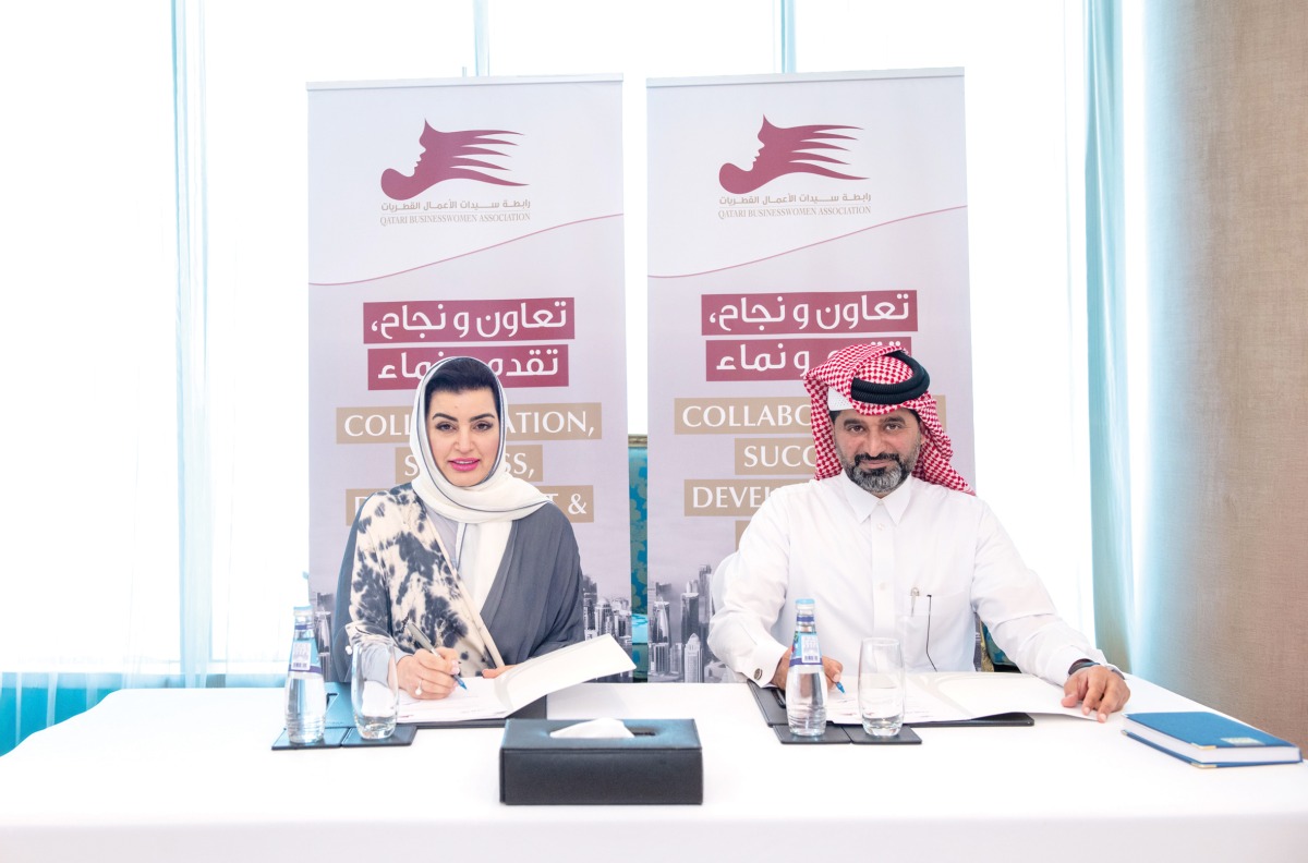 Aisha Alfardan, Vice Chairwoman of QBWA, and Mohamed Al Naimi, CEO of AMLAK Holding during the MoU signing.