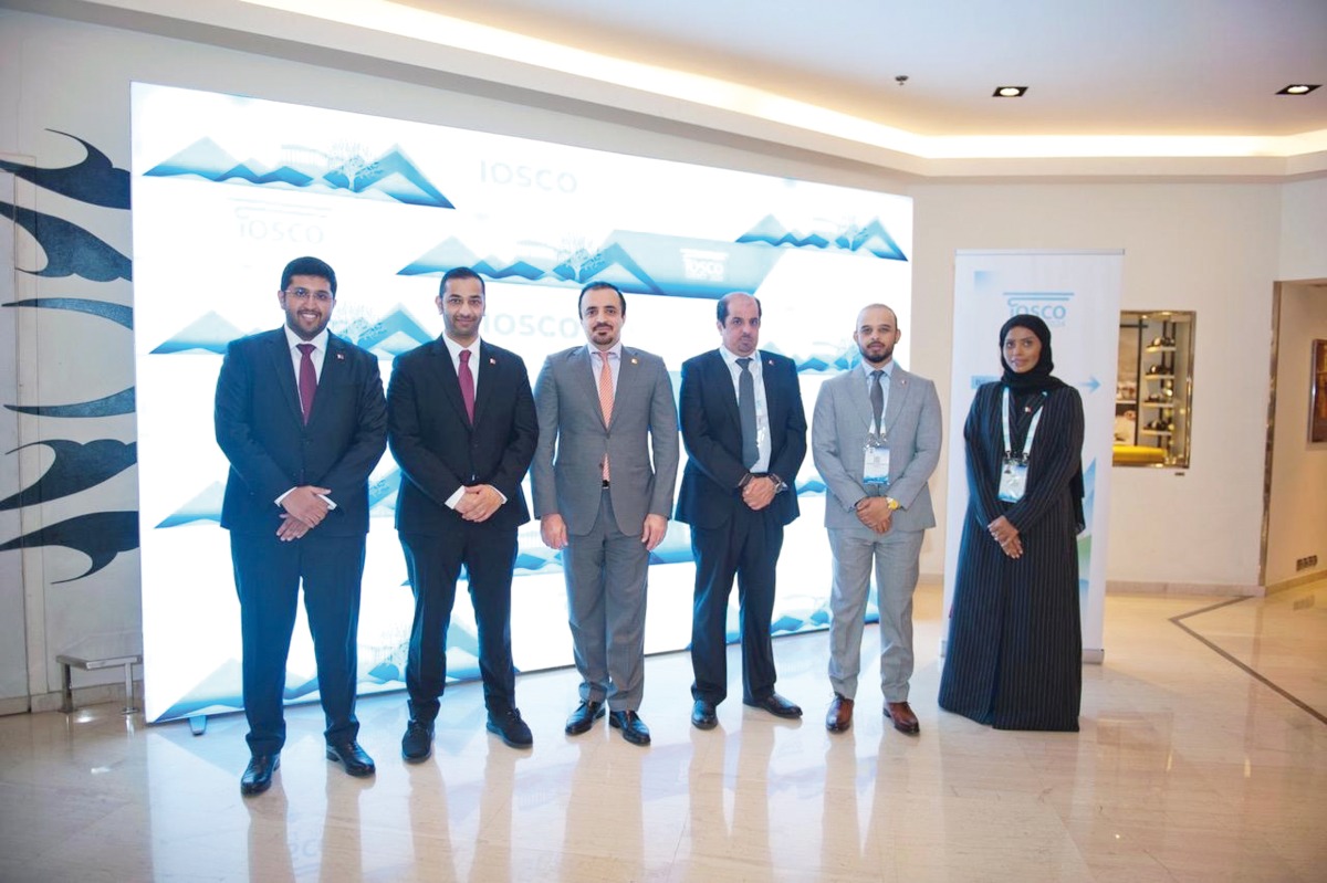 QFMA CEO Dr. Tamy Bin Ahmad Al-Binali pose for a group photo with other officials.