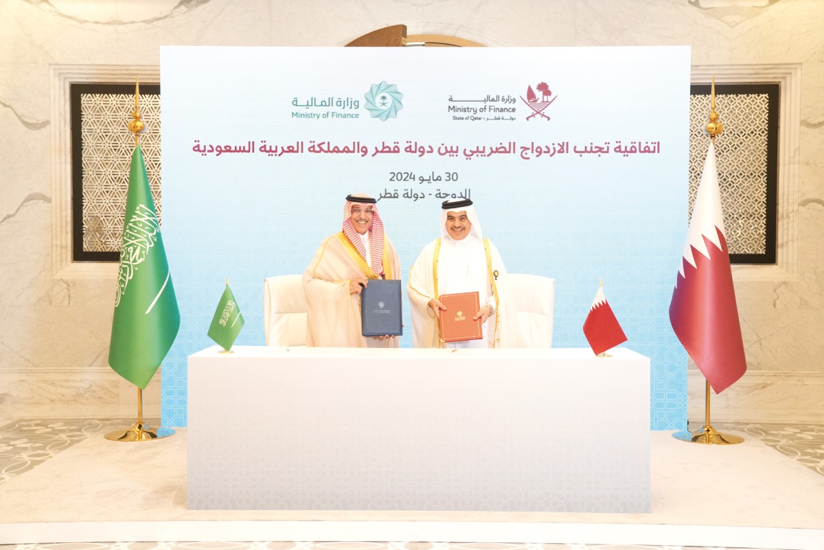 Minister of Finance H E Ali bin Ahmed Al Kuwari and Minister of Finance of the Kingdom of Saudi Arabia H E Mohammed Aljadaan during the agreement signing.