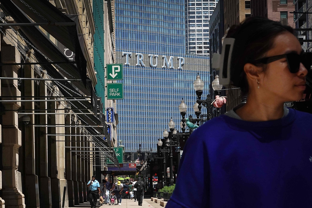 People walk downtown near the Trump International Hotel & Tower on May 30, 2024 in Chicago, Illinois. Scott Olson/Getty Images/AFP 