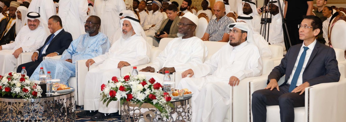 Minister of Awqaf and Islamic Affairs H E Ghanem bin Shaheen bin Ghanem Al Ghanim (third right) and other officials and guests at the event. 