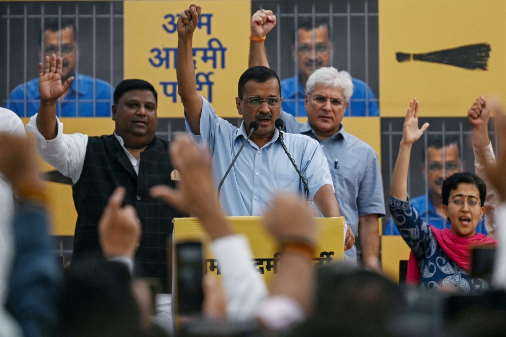 Arvind Kejriwal (C), Chief Minister of the capital Delhi and leader of the Aam Aadmi Party (AAP), addresses his supporters at the AAP's headquarters on June 2, 2024. (Photo by Arun Sankar / AFP)