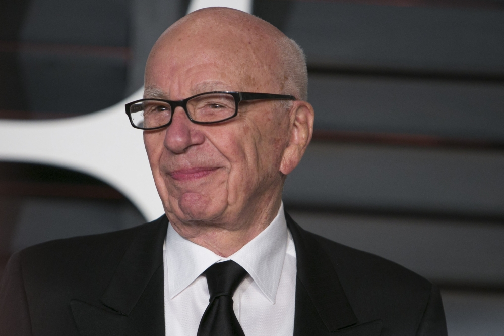 This picture taken on February 22, 2015 shows Rupert Murdoch arriving at the 2015 Vanity Fair Oscar Party in Beverly Hills, California. (Photo by Adrian Sanchez-Gonzalez / AFP)