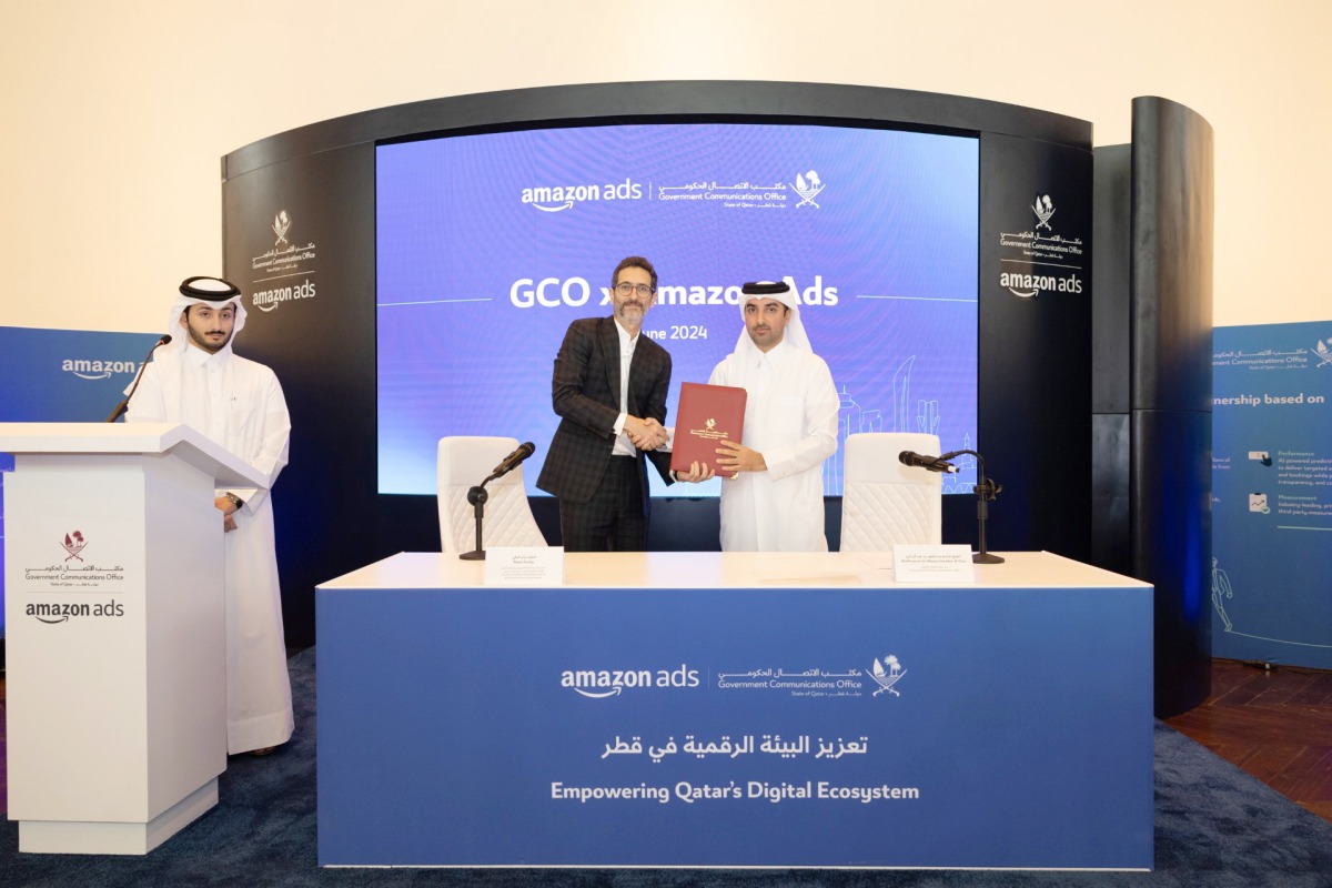 GCO Director Sheikh Jassim bin Mansour bin Jabor Al Thani (right) and International Expansion Managing Director EMEA and Southeast Asia at Amazon, Rayan Karaky, exchanging documents after signing the agreement in Doha, yesterday.