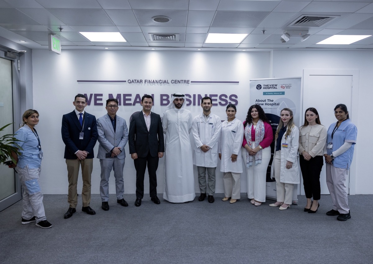 QFC, The View Hospital officials pose for a group picture during the wellness event.