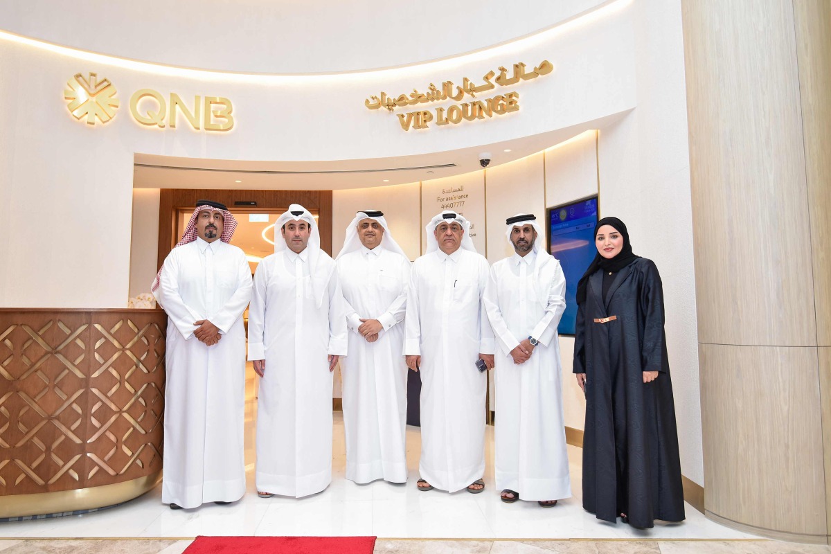 Officials pose for a group photo at the Premium VIP Lounge at Printemps Doha Oasis.