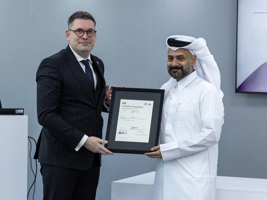 Yousuf Mohamed Al Jaida, Chief Executive Officer, QFC receiving the ISO certification from Ilias Karampoikis, IMETA Sales and Commercial Director, BSI.