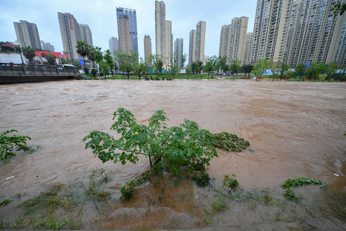 Changsha: This photo shows the rising water level of a river in Changsha, central China's Hunan Province, June 24, 2024. On Monday, Changsha of central China's Hunan Province saw 15 waterlogged roads after intense rain. The city has launched a Level III emergency response for Floods. (Xinhua/Chen Zeguo)