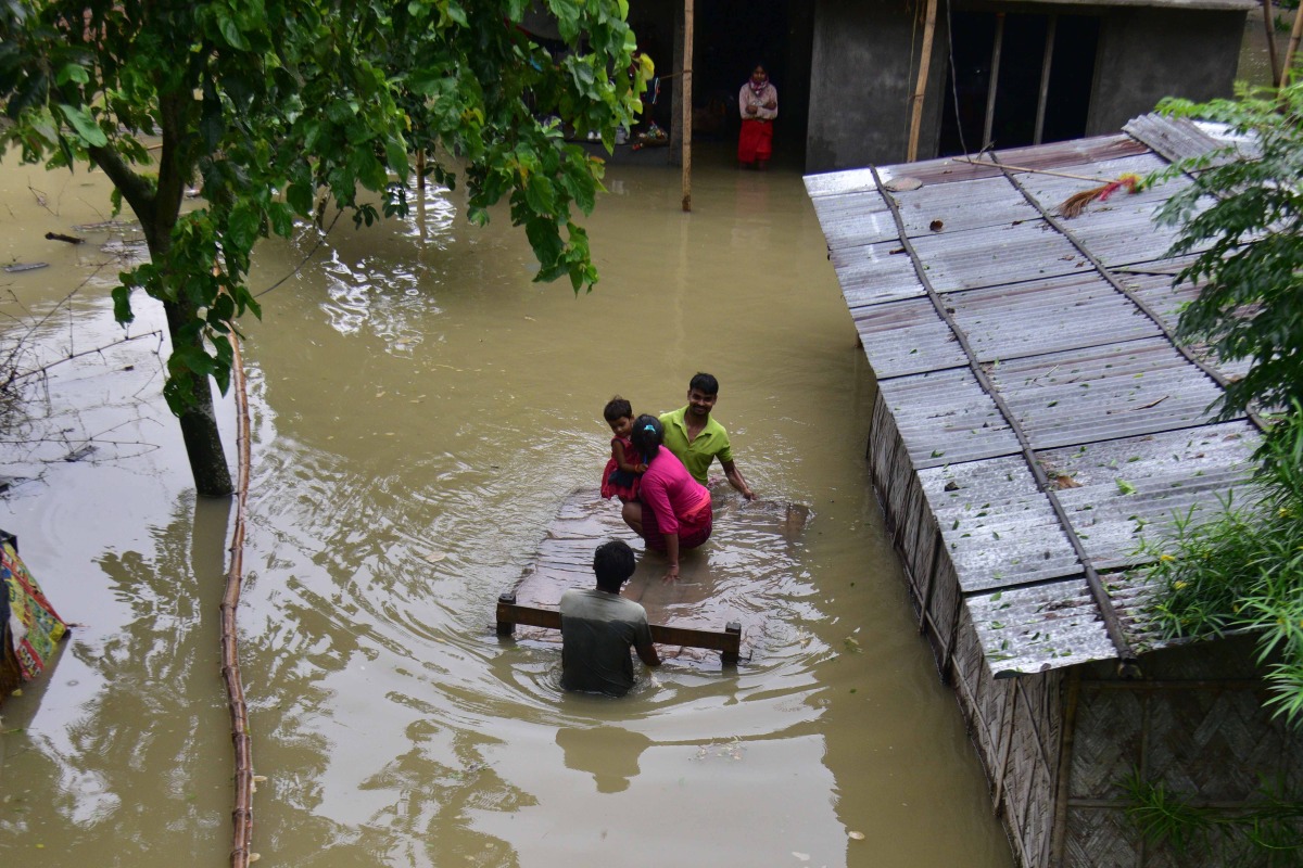July 2, 2024 (Xinhua) -- Floods swamp a residential area following a heavy rainfall in Nagaon district of India's northeastern state of Assam on July 1, 2024. 