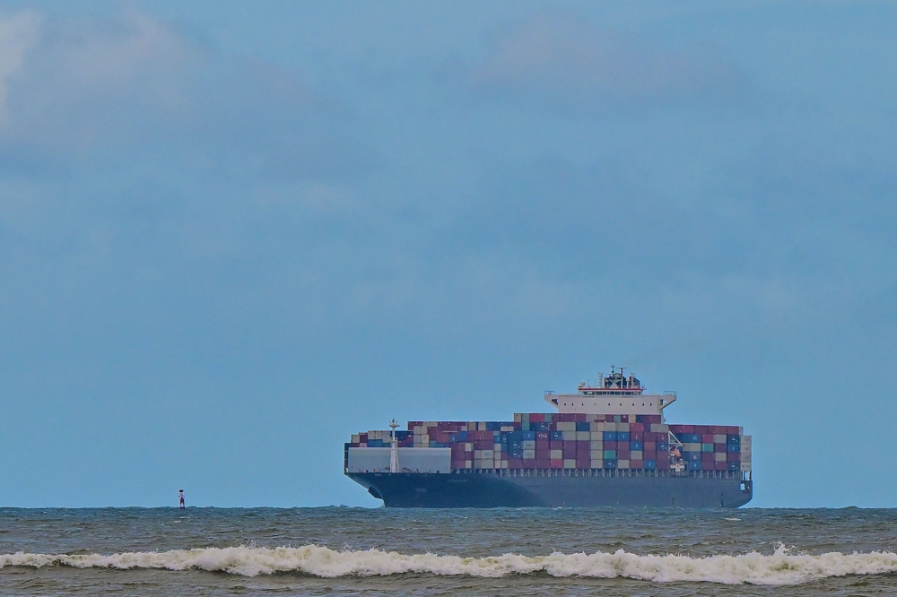 A cargo ship loaded with containers departs from the Colombo International Container Terminal (CICT) in Colombo on July 1, 2024. (Photo by Ishara S.Kodikara / AFP)
