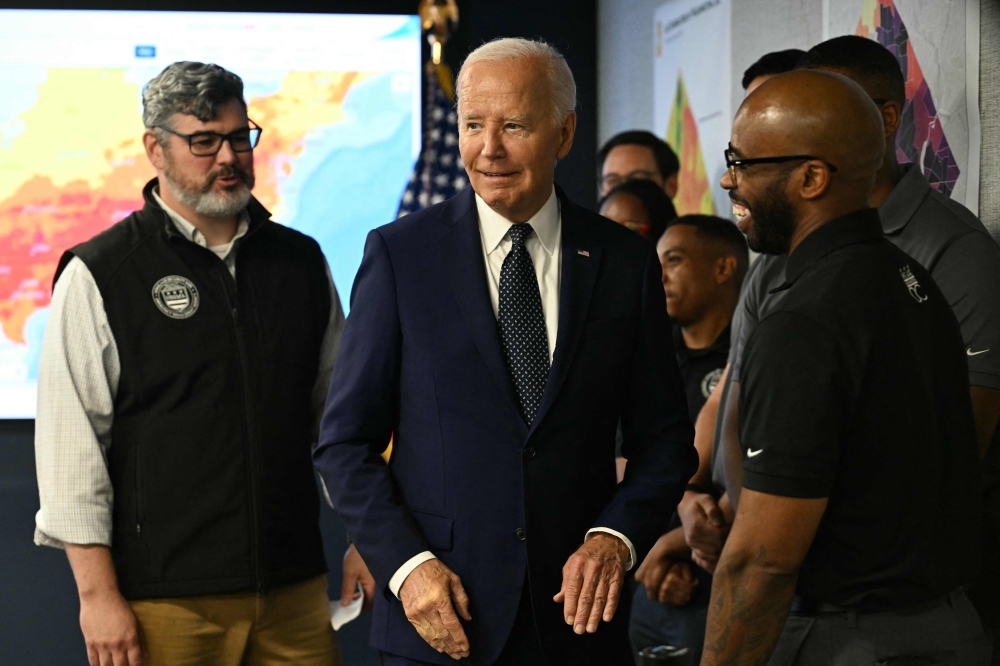 US President Joe Biden (centre) looks on at the DC Emergency Operations Center in Washington, DC, July 2, 2024. (Photo by Jim Watson / AFP)