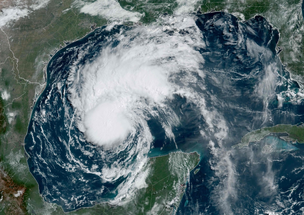 This National Oceanic and Atmospheric Administration (NOAA)/GOES satellite handout image shows Tropical Storm Beryl at 14:56 UTC on July 6, 2024, in the Gulf of Mexico. (Photo by Handout / NOAA/GOES / AFP) 