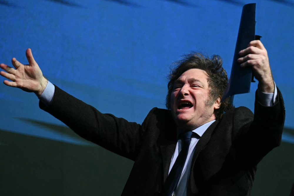 Argentina's President Javier Milei gestures during the CPAC Brazil conference in Camboriu, Santa Catarina State, Brazil on July 7, 2024. (Photo by EVARISTO SA / AFP)
