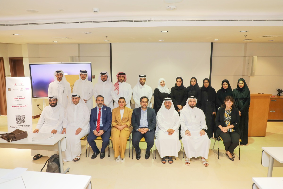 QRCS Secretary-General, Faisal Mohamed Al Emadi (second right, front) and other officials at the workshop.