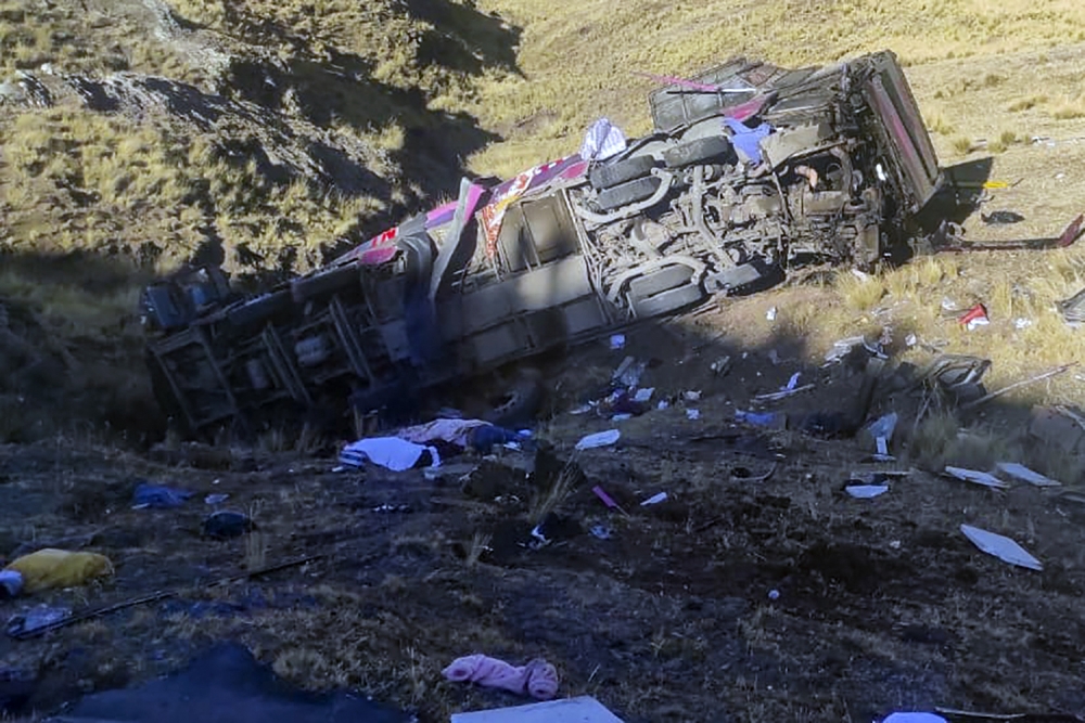 This picture released by the Peruvian National Police shows a bus that plunged down a ravine on a remote site in the Andes, Peru, on July 16, 2024. (Photo by Handout / Peruvian National Police / AFP)
