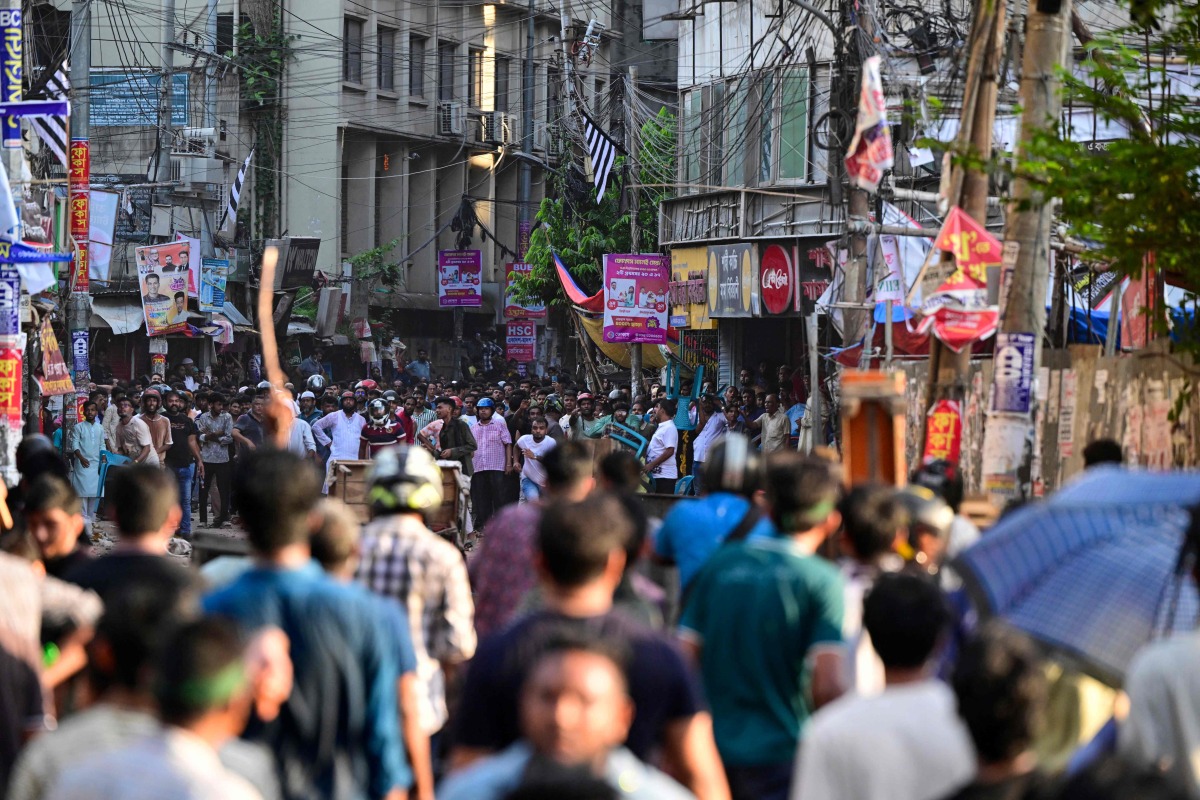 Anti-quota protesters and students backing the ruling Awami League party clash in Dhaka on July 16, 2024. (Photo by MUNIR UZ ZAMAN / AFP)