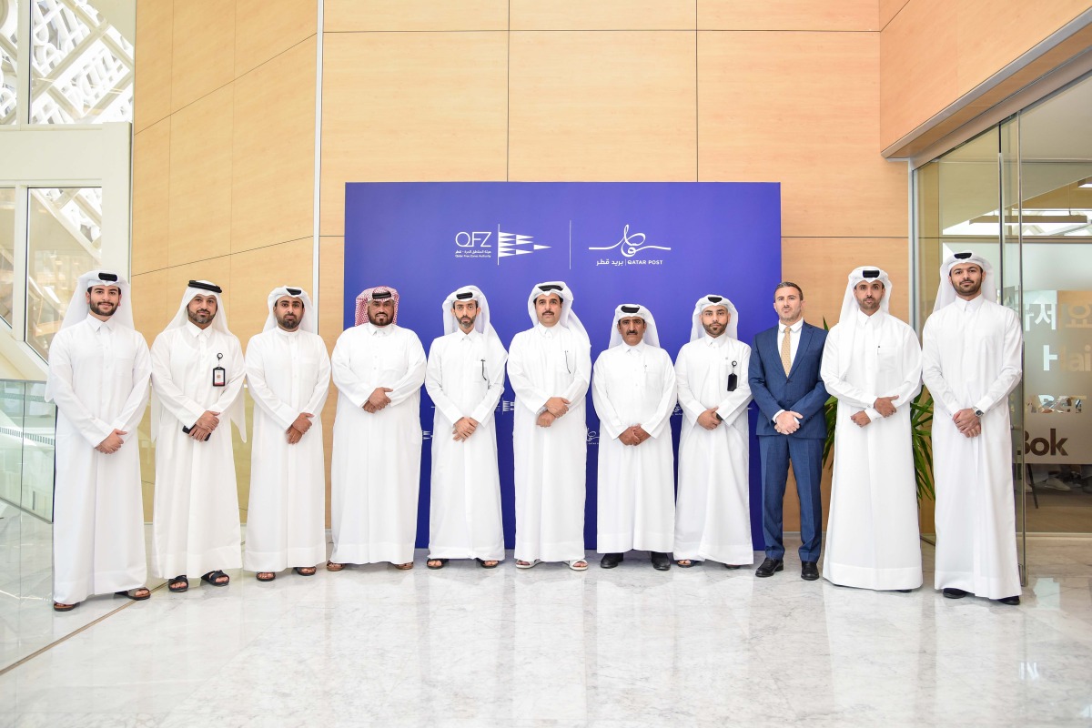 Qatar Post and QFZ officials during the event.