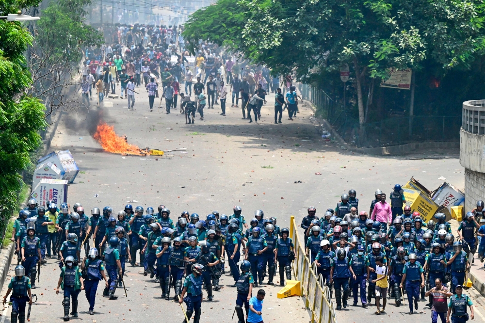 Anti-quota protesters clash with the police in Dhaka on July 18, 2024. (Photo by Munir Uz Zaman / AFP)