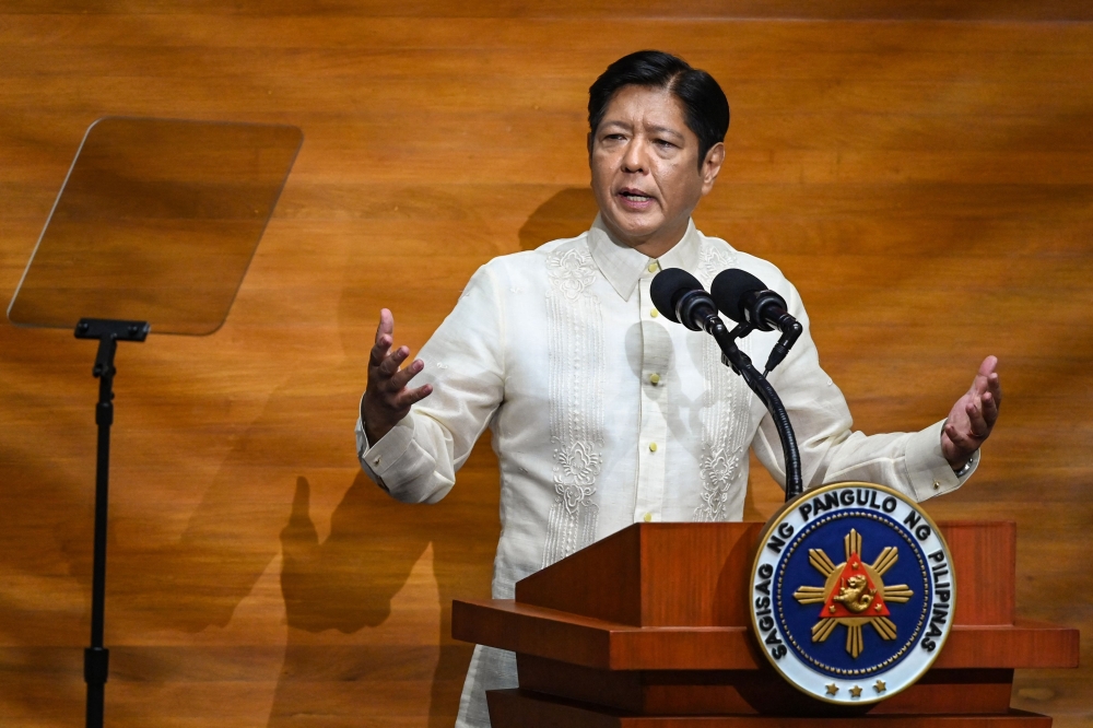 Philippine President Ferdinand Marcos delivers the annual State of the Nation Address at the House of Representatives in Manila on July 22, 2024. (Photo by JAM STA ROSA / AFP)