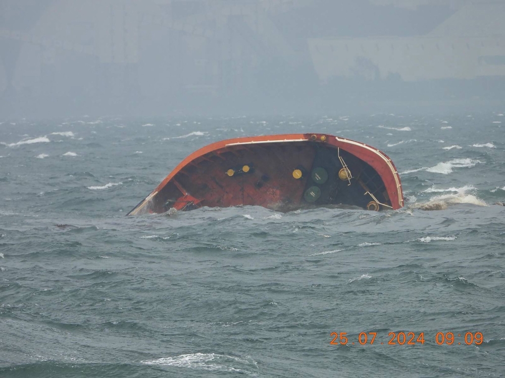 This handout photo taken on July 25, 2024 and received from the Philippine Coast Guard (PCG) shows part of MT Terra Nova oil tanker after it sank off Manila Bay. Photo by Handout / Philippine Coast Guard (PCG) / AFP