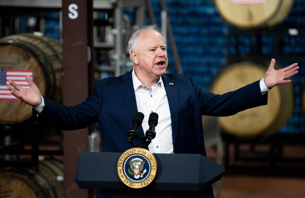 (FILES) Minnesota Governor Tim Walz speaks about funding for the I-535 Blatnik Bridge before a visit by US President Joe Biden at Earth Rider Brewery on January 25, 2024 in Superior, Wisconsin. (Photo by Stephen Maturen / GETTY IMAGES NORTH AMERICA / AFP)
