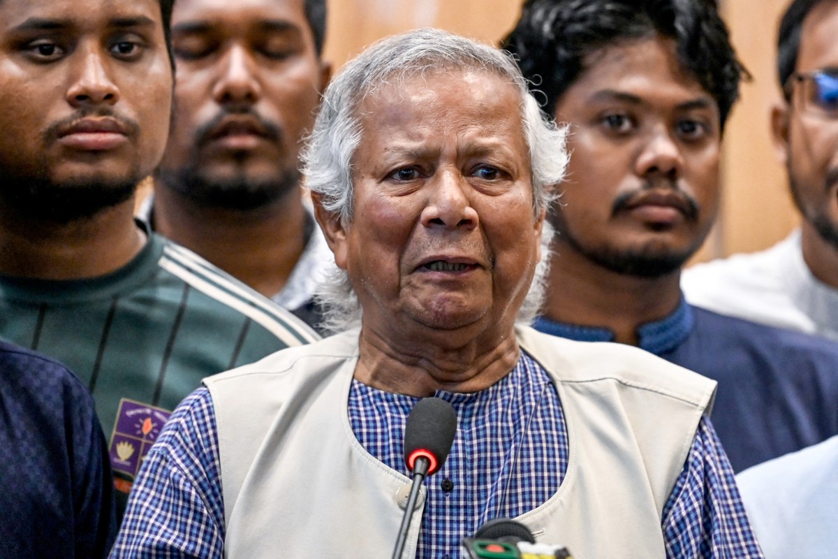 Nobel laureate Muhammad Yunus (C) speaks during a press conference upon his arrival at the Hazrat Shahjalal International Airport in Dhaka on August 8, 2024. 
 (Photo by Munir UZ ZAMAN / AFP)