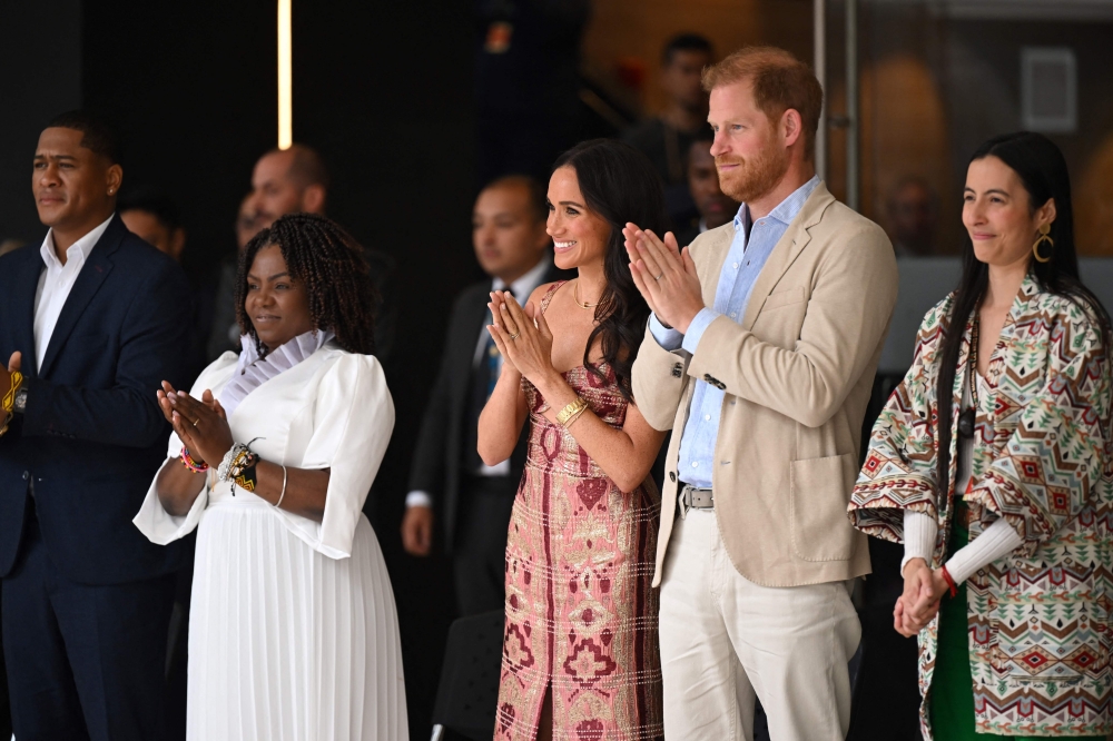 Britain's Prince Harry (2nd right), Duke of Sussex, and his wife Meghan Markle, Colombia's vice-President Francia Marquez (2nd left) and her partner Yerney Pinillo, and the director of the National Centre for the Arts Xiomara Suescun attend a performance at the centre in Bogota on August 15, 2024. (Photo by Raul Arboleda / AFP)