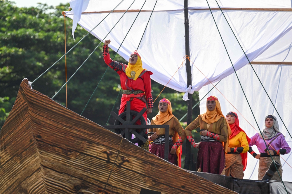 Performers take part in a ceremonial event to mark Indonesia's 79th Independence Day in Banda Aceh on August 17, 2024. (Photo by CHAIDEER MAHYUDDIN / AFP)