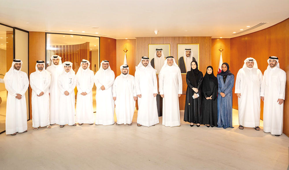 Minister of Communications and Information Technology H E Mohammed bin Ali Al Mannai with the first batch of MCIT employees selected for the Overseas Internship Program.