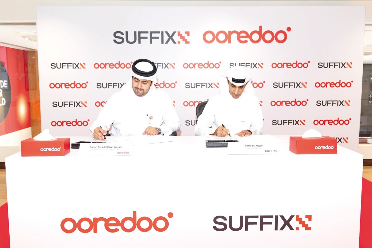 Director of Public Relations, Social Responsibility, and Sponsorships at Ooredoo Qatar Sabah Rabiah Al Kuwari and Suffix’s General Manager Ahmad Al Majed signing the agreement.