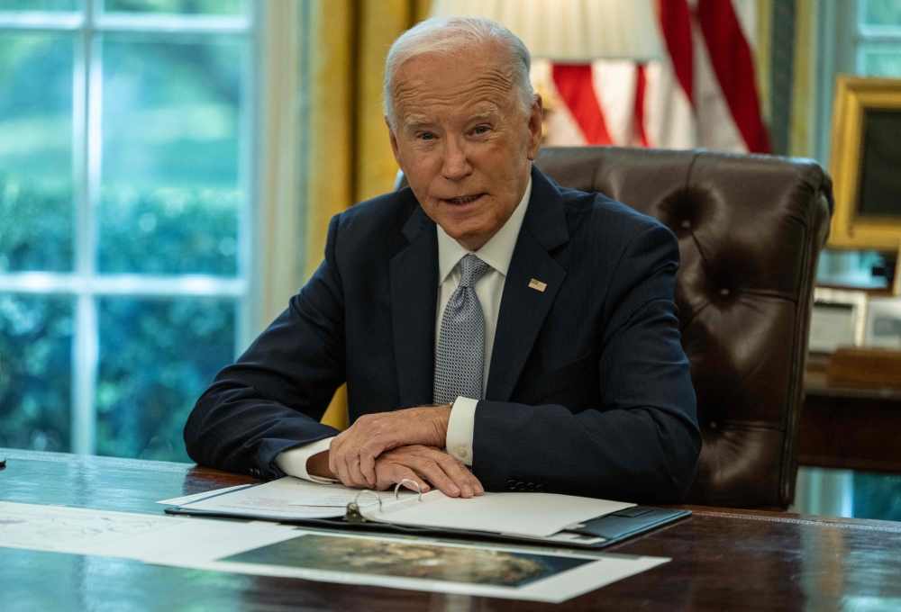 US President Joe Biden speaks to the press before participating in a briefing regarding the ongoing wildfire season response and Federal efforts to reduce wildfire risk, in the Oval Office at the White House in Washington, DC, on September 17, 2024. (Photo by Andrew Caballero-Reynolds / AFP)
