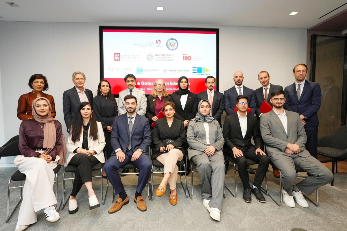 Minister of State for International Cooperation H E Lolwah bint Rashid Al Khater (fifth right, standing) with other participants at the event.
