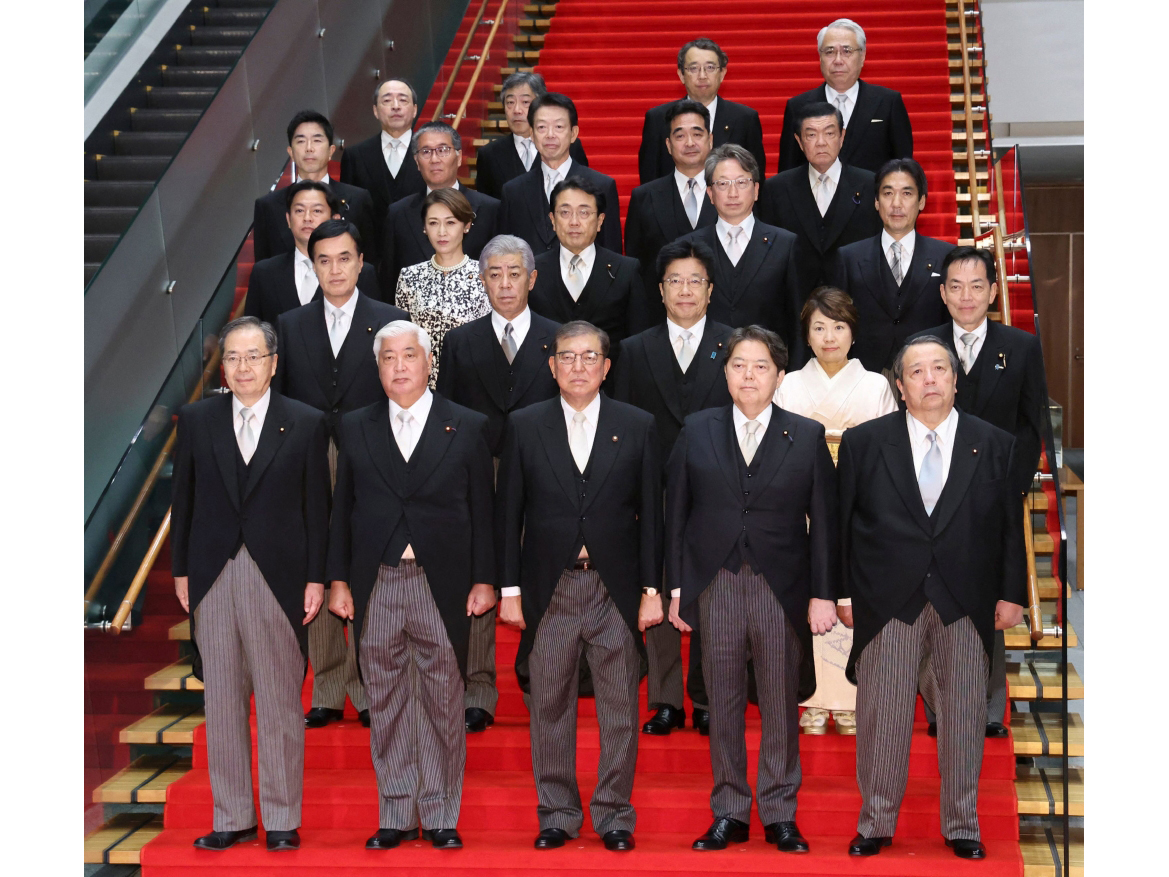 This picture taken on October 1, 2024 shows Japan's new Prime Minister Shigeru Ishiba (front C) posing during a photo session with the members of his cabinet at the prime minister's official residence in Tokyo. (Photo by JIJI PRESS / AFP) 