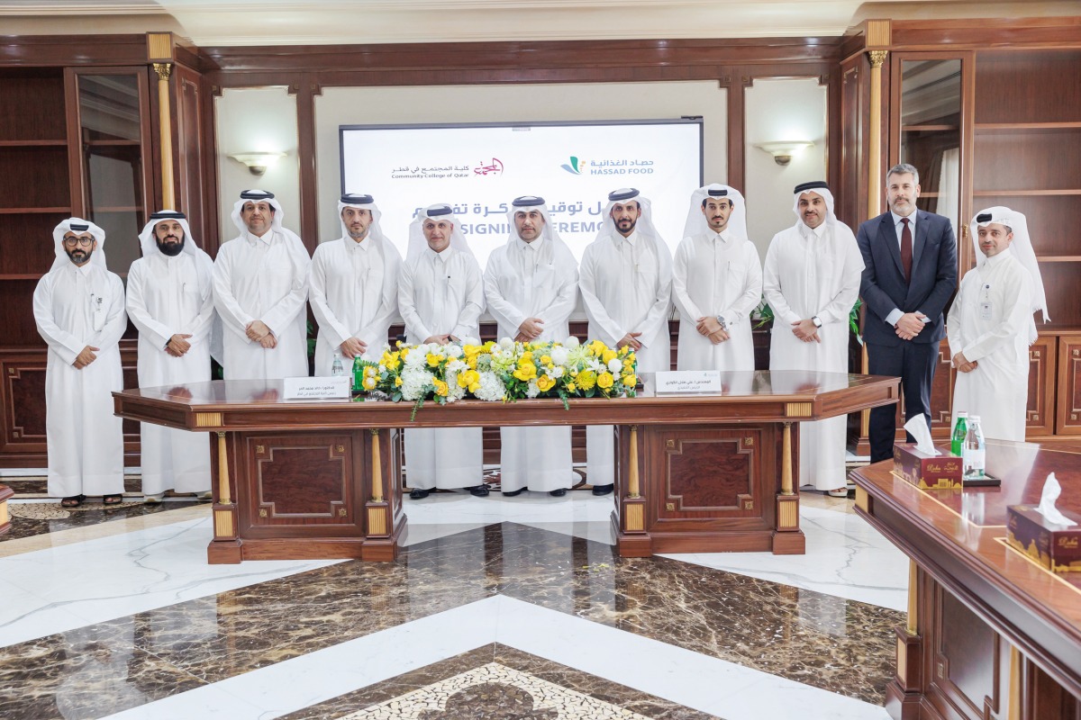 CCQ President Dr. Khalid Mohamed Al Horr (fifth left), CEO of Hassad Food Company Engineer Ali Hilal Al Kuwari (sixth right) and other officials at the agreement signing ceremony.