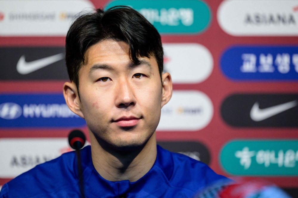 South Korean national football team captain Son Heung-min listens to a question during a press conference before team practice sessions at Seoul World Cup Stadium on March 20, 2024, a day ahead of the FIFA World Cup Asian qualifiers second round group C match between South Korea and Thailand. (Photo by ANTHONY WALLACE / AFP)

