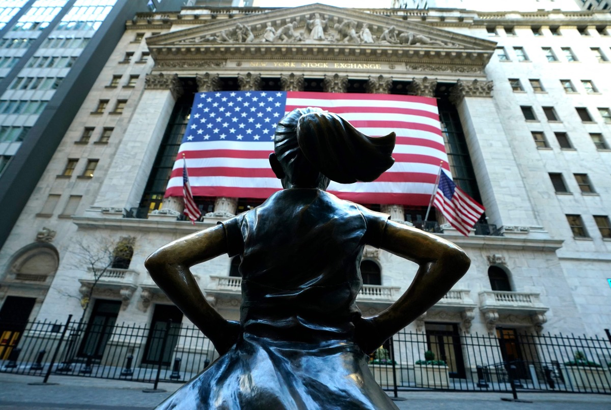 The “Fearless Girl” a bronze sculpture by Kristen Visbal, stands across from the New York Stock Exchange (NYSE) building in the Financial District in New York City on November 6, 2024. (Photo by TIMOTHY A. CLARY / AFP)
