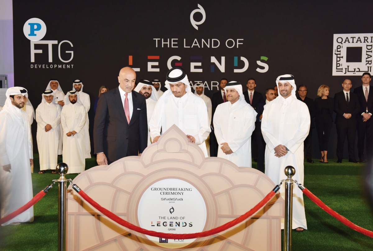 Prime Minister and Minister of Foreign Affairs, H E Sheikh Mohammed bin Abdulrahman bin Jassim Al Thani, laying the foundation stone of 'Land of Legends' project along with the Deputy Prime Minister and Minister of State for Defence Affairs, H E Sheikh Saoud bin Abdulrahman bin Hassan bin Ali Al Thani (second right), Minister of Municipality and Chairman of Qatari Diar Real Estate Investment Company, H E Abdullah bin Hamad bin Abdullah Al Attiyah (right), and the Founder of FTG Development, Fettah Tamince and other officials in Simaisma yesterday. Pic: Salim Matramkot / The Peninsula 