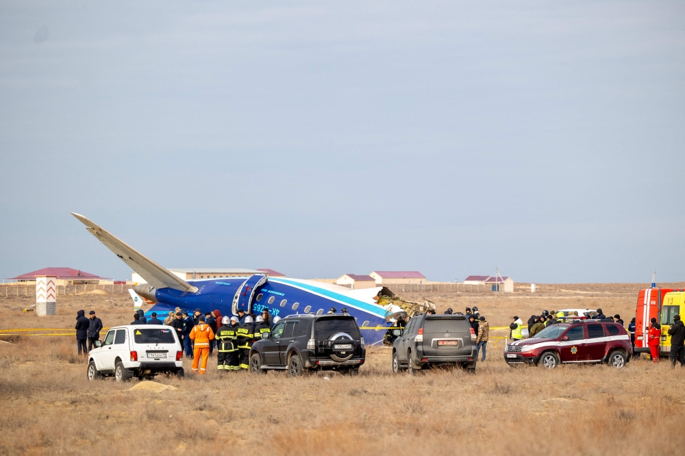 Scene from the crash site of an Azerbaijan Airlines passenger jet near the western Kazakh city of Aktau on December 25, 2024. (Photo by Issa Tazhenbayev / AFP)