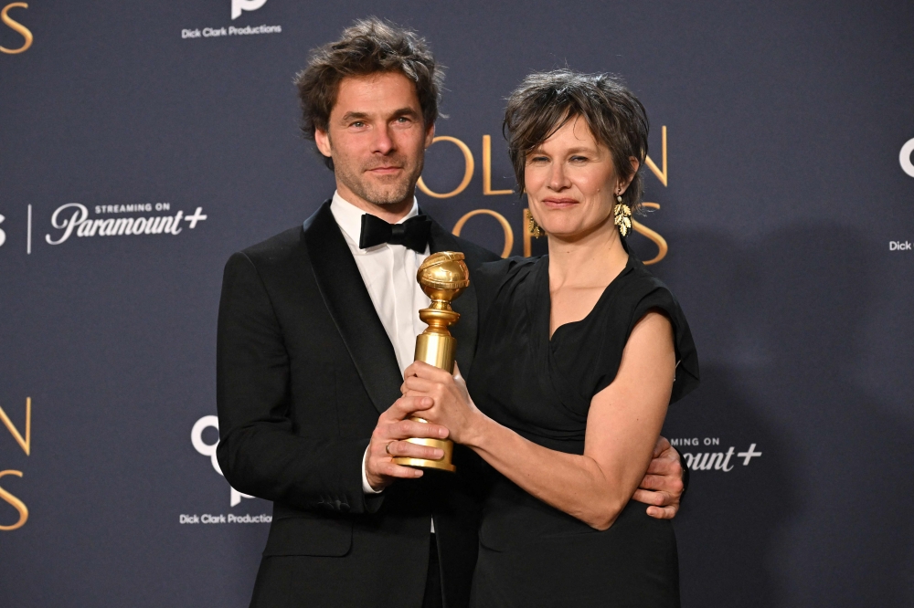 French composer Clement Ducol (L) and French singer Camille accept the award for song Best Original Song - Motion Picture for