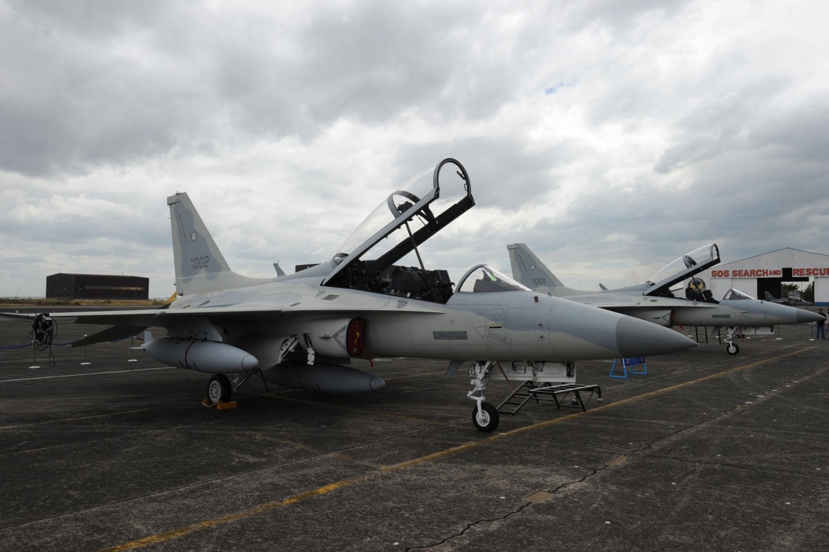 (FILES) In this photo taken on November 28, 2015 South Korean-made FA-50 multirole light fighter aircrafts with tail numbers 002 (L) and 001 (R) for the Philippine Air Force are parked on the tarmac shortly after arriving at Clark Air Base in Angeles City, Pampanga province. (Photo by Ted ALJIBE / AFP)
