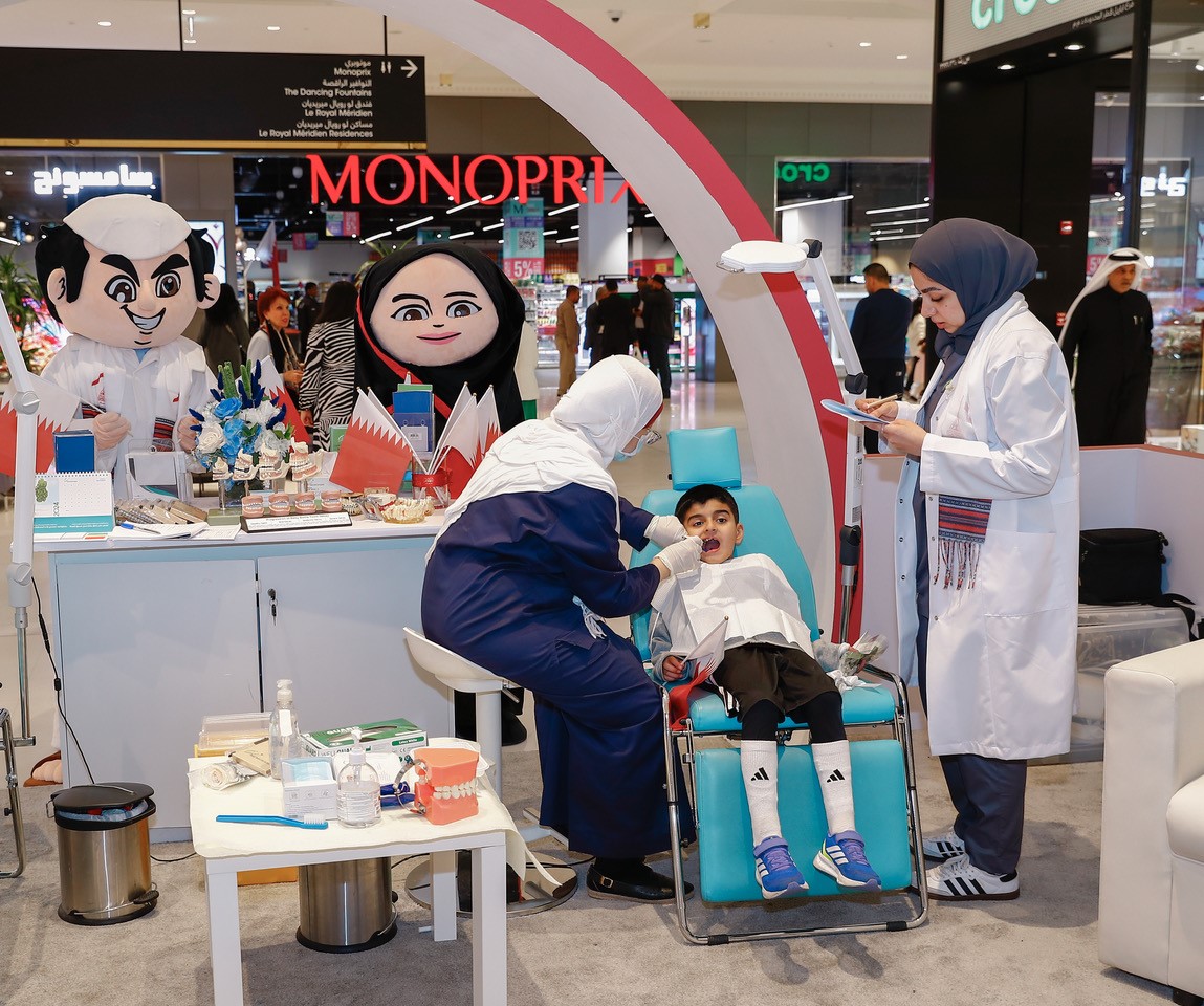 A PHCC team provides dental checkups for children at a mall. 