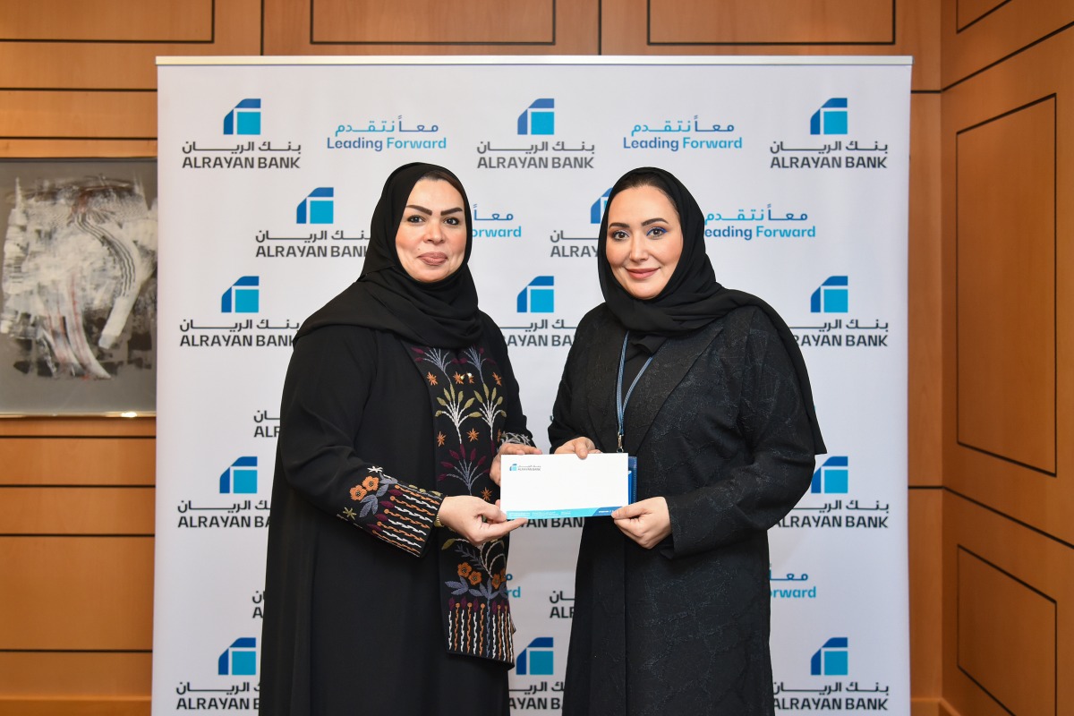 General Manager, Personal Banking, Rana Al Asaad (right) presenting the support to QCS General Manager, Mona Ashkanani.