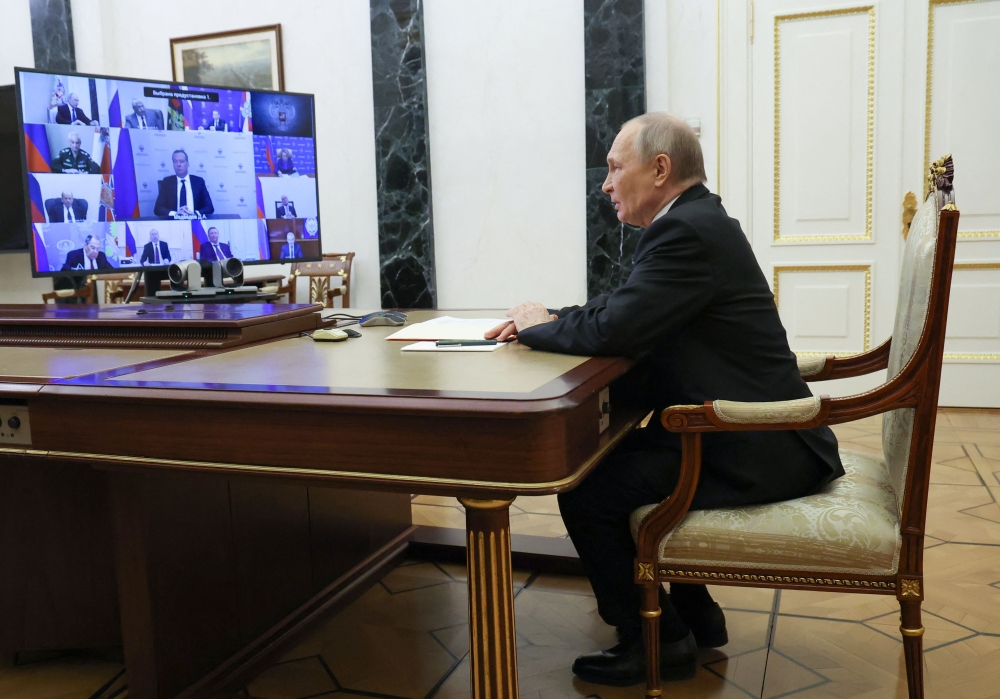In this pool photograph distributed by the Russian state agency Sputnik, Russia's President Vladimir Putin chairs a Security Council meeting via videoconference at the Kremlin in Moscow on March 28, 2025. (Photo by Vyacheslav Prokofyev / POOL / AFP)

