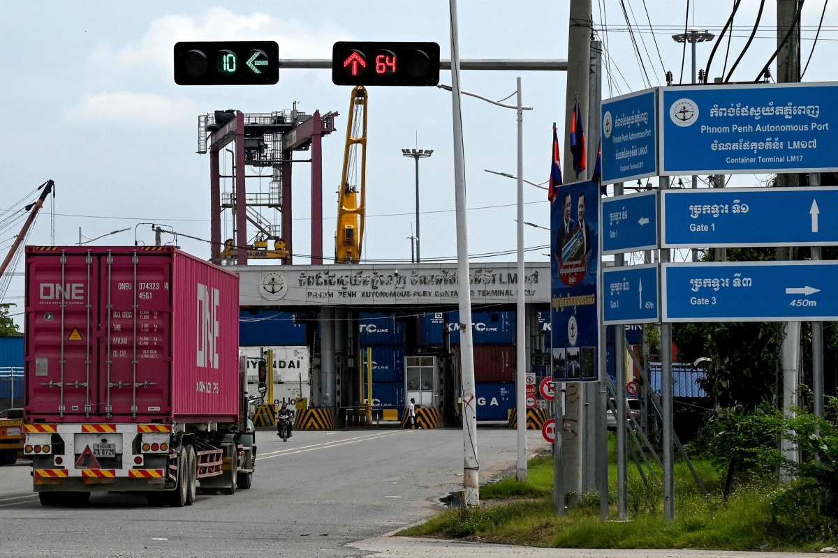 A truck transports a container toward the entrance of the Phnom Penh Autonomous Port on April 3, 2025. Photo by TANG CHHIN Sothy / AFP